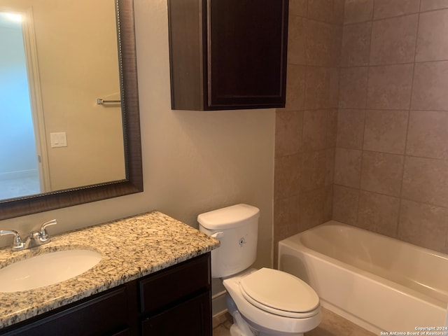 full bathroom featuring vanity, toilet, and tiled shower / bath