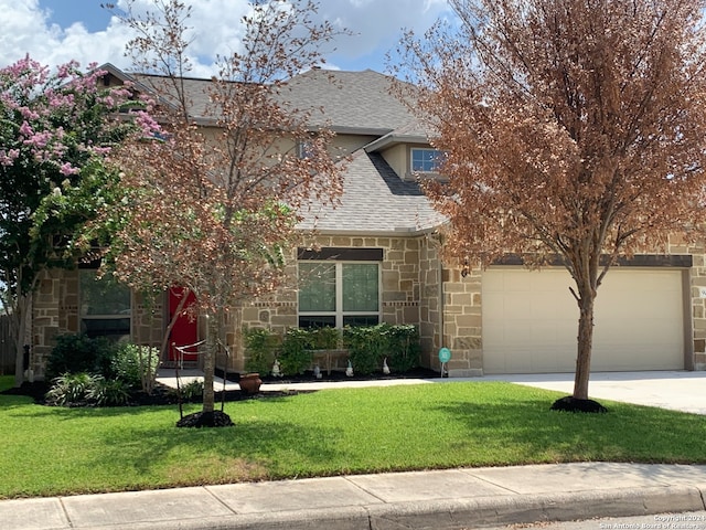 view of front of home featuring a garage and a front yard