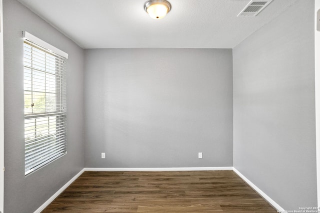 empty room with wood-type flooring