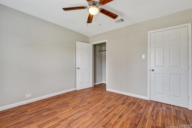 unfurnished bedroom featuring ceiling fan and hardwood / wood-style floors