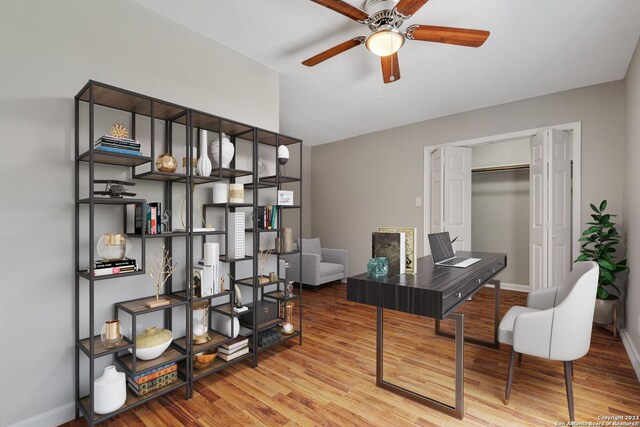 home office with ceiling fan and hardwood / wood-style floors