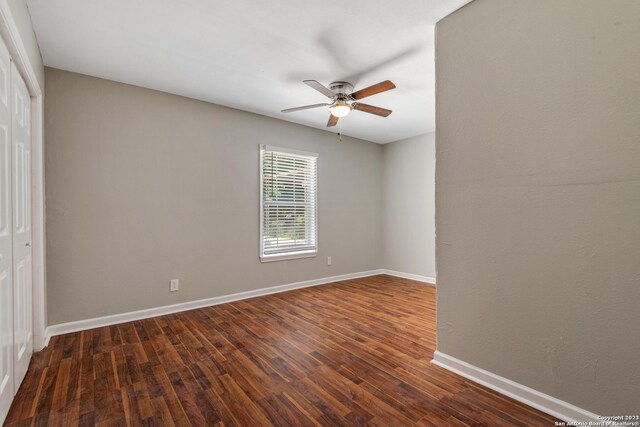 empty room featuring hardwood / wood-style flooring and ceiling fan