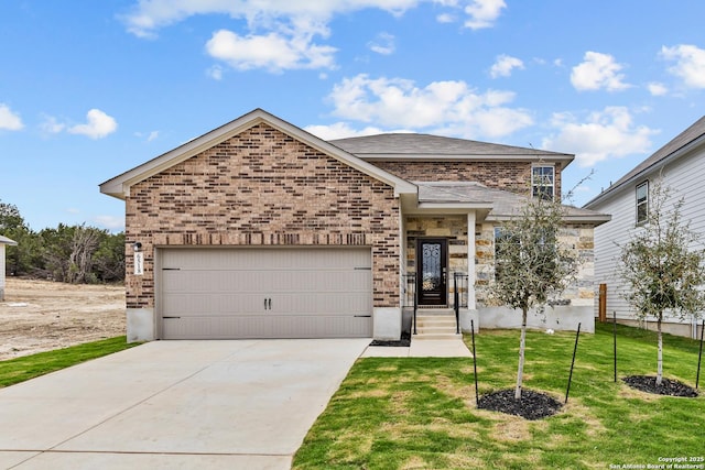 view of front of property featuring a garage and a front lawn