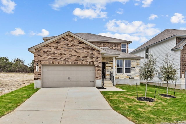 view of front of property with a garage and a front lawn