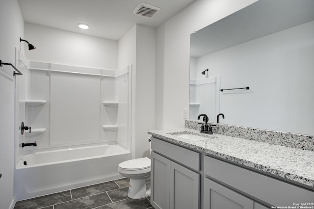 6934 Comanche Cave, San Antonio, TX 78233 - full bath featuring vanity, washtub / shower combination, toilet, tile patterned flooring, and visible vents