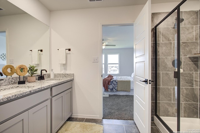 6934 Comanche Cave, San Antonio, TX 78233 - full bathroom with a shower stall, ensuite bath, tile patterned floors, and a sink