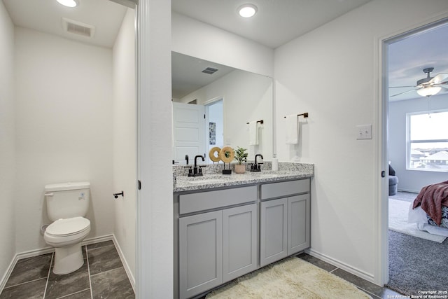 6934 Comanche Cave, San Antonio, TX 78233 - ensuite bathroom featuring baseboards, ensuite bathroom, visible vents, and a sink