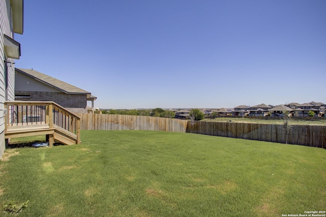 6934 Comanche Cave, San Antonio, TX 78233 - view of yard with a fenced backyard, a residential view, and a deck