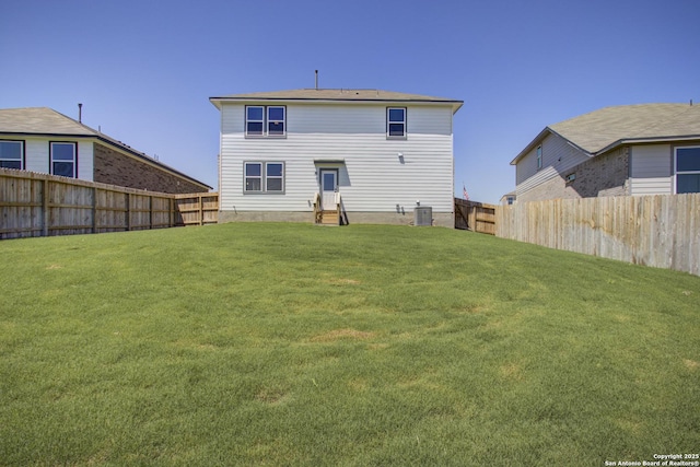 6934 Comanche Cave, San Antonio, TX 78233 - back of house featuring a fenced backyard, a yard, cooling unit, and entry steps