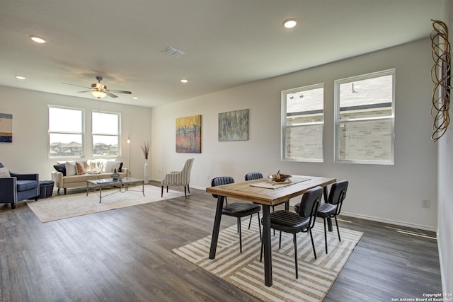 6934 Comanche Cave, San Antonio, TX 78233 - dining room with wood finished floors, visible vents, a ceiling fan, and baseboards
