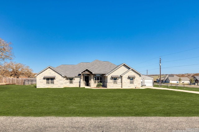 view of front of home featuring a garage and a front yard