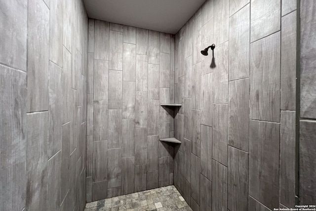 bathroom with a tile shower