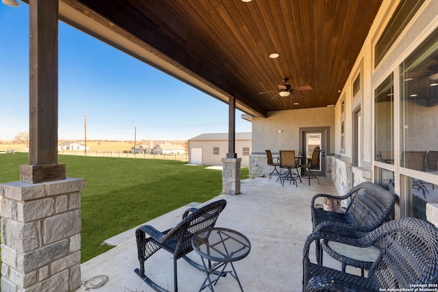 view of patio featuring ceiling fan