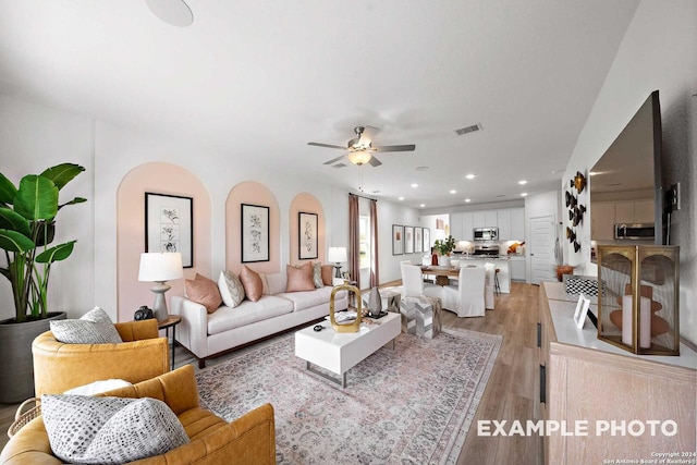 10326 Gala Jct, San Antonio, TX 78224 - living room with ceiling fan, recessed lighting, visible vents, and light wood-type flooring