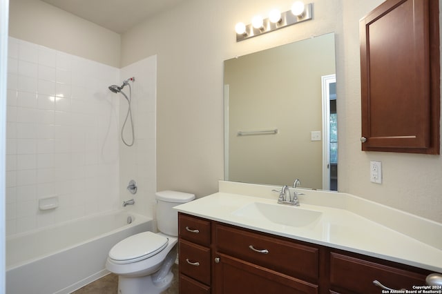 full bathroom with vanity, toilet, and tiled shower / bath