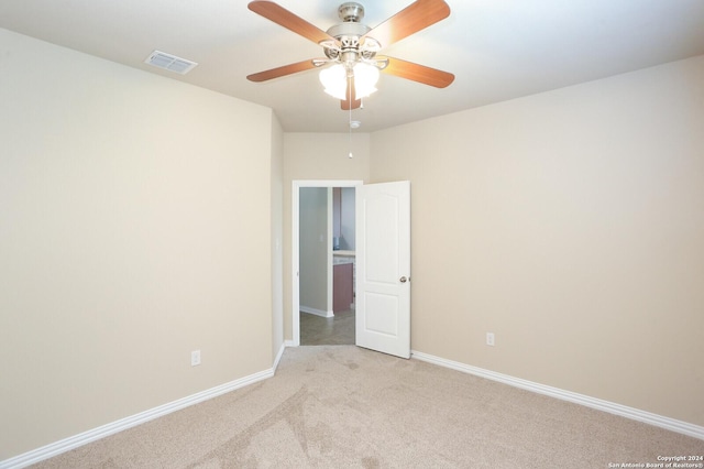 empty room with light carpet and ceiling fan