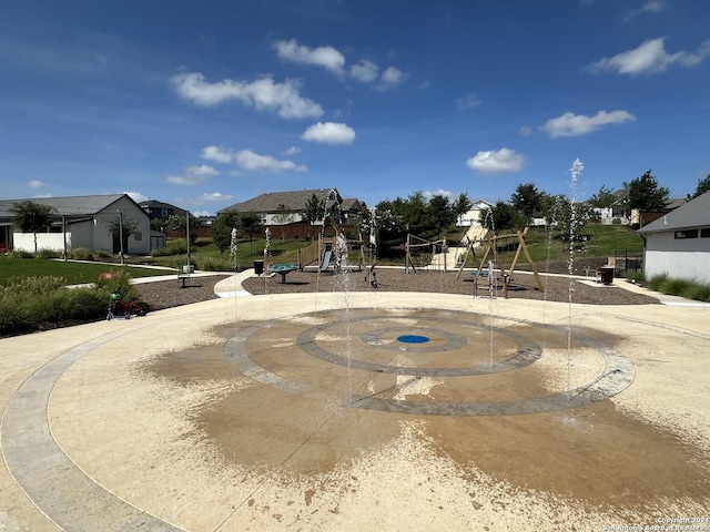 view of property's community with a playground