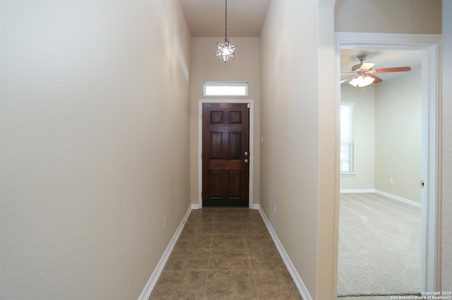 doorway to outside with tile patterned floors