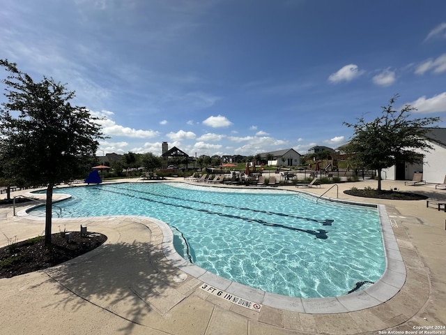 view of swimming pool with a patio area