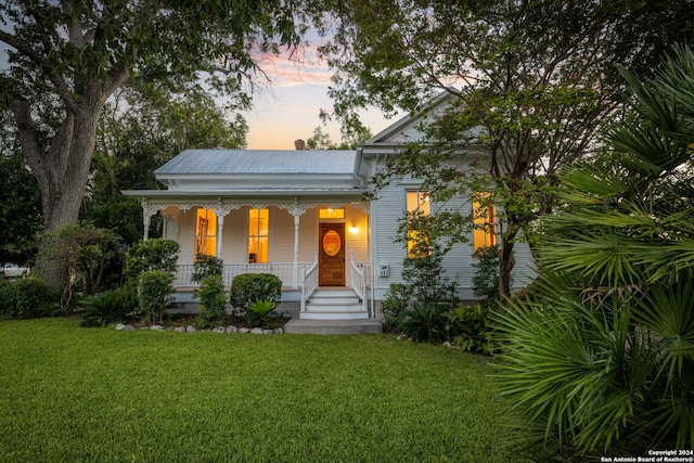 exterior entry at dusk with a porch