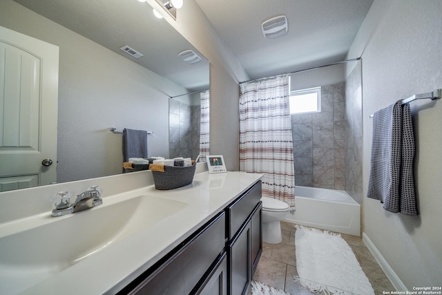 full bathroom with vanity, shower / bath combination with curtain, tile patterned floors, and toilet