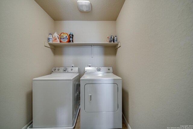 washroom featuring washer and dryer