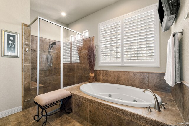 bathroom with plus walk in shower and tile patterned flooring