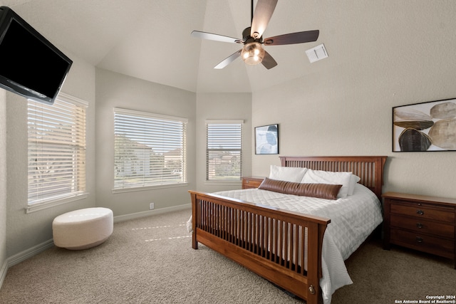 carpeted bedroom featuring ceiling fan and vaulted ceiling