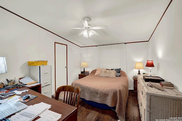 bedroom with crown molding, vaulted ceiling, and dark hardwood / wood-style floors