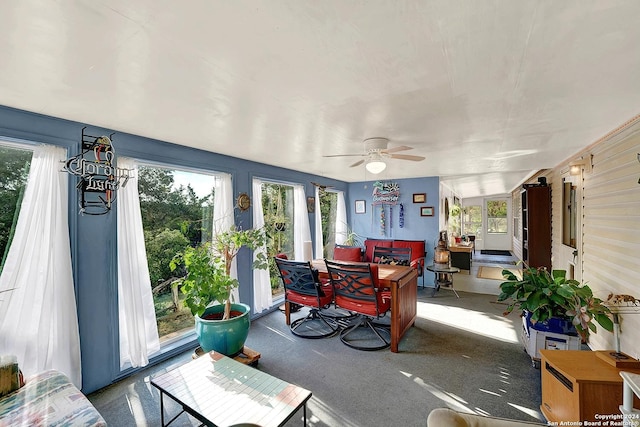 sunroom / solarium with ceiling fan