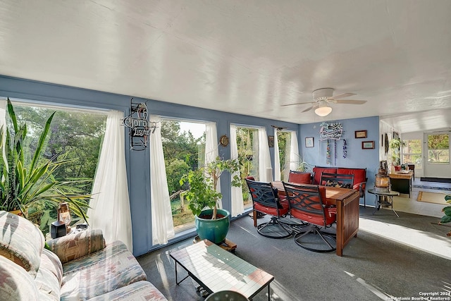 sunroom / solarium featuring ceiling fan