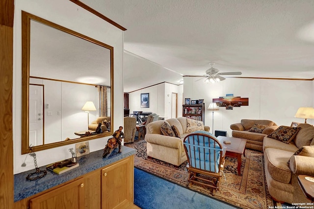 living room featuring vaulted ceiling, ornamental molding, ceiling fan, and a textured ceiling