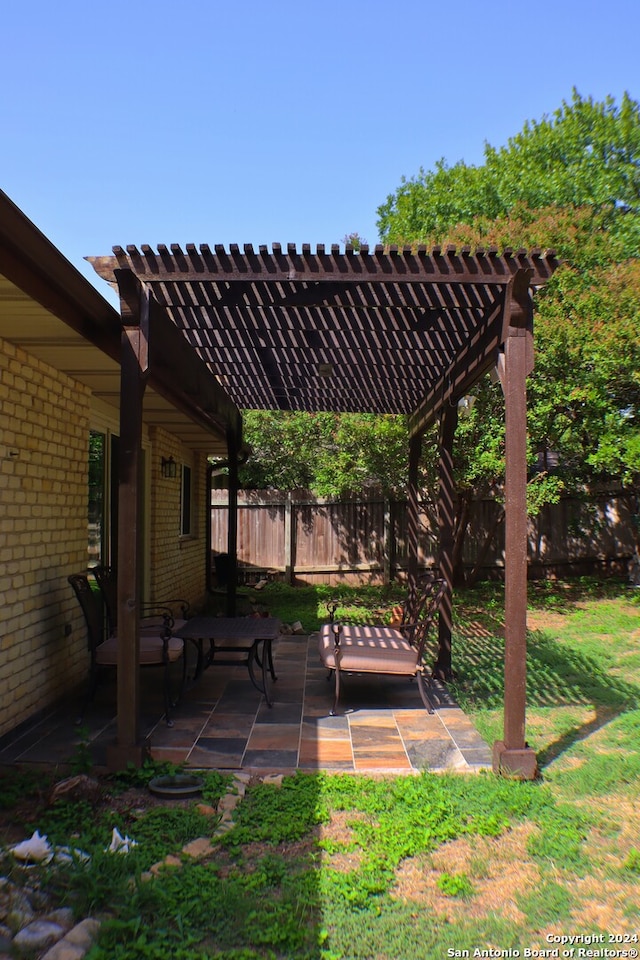 view of yard featuring a patio and a pergola