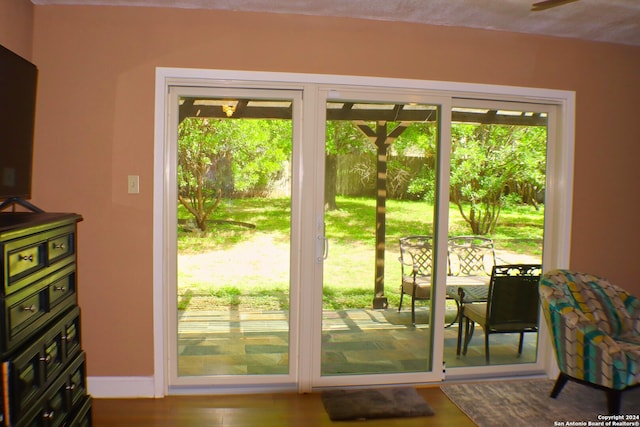 entryway with hardwood / wood-style flooring