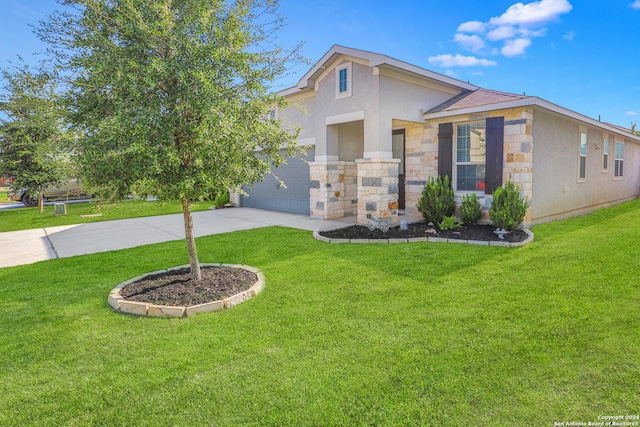 view of front of property with a garage and a front lawn