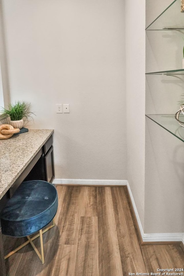 bathroom with hardwood / wood-style flooring