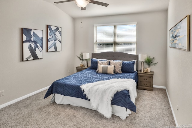 bedroom with carpet flooring, ceiling fan, and vaulted ceiling