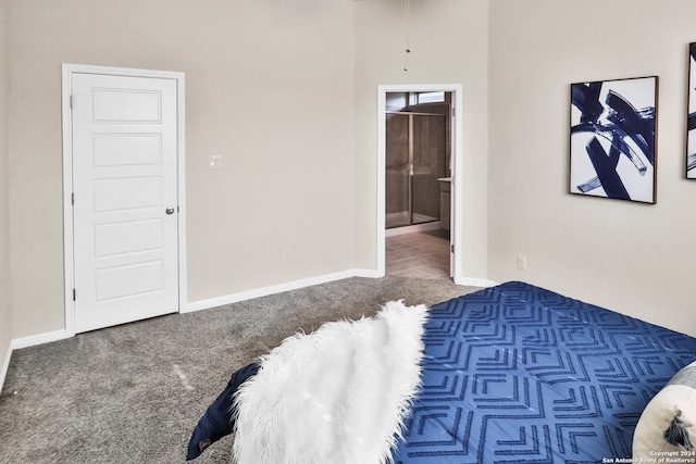 bedroom featuring carpet floors and connected bathroom