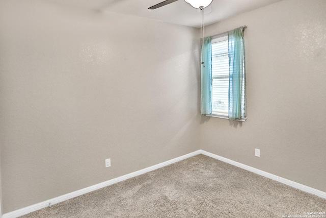 carpeted empty room with ceiling fan