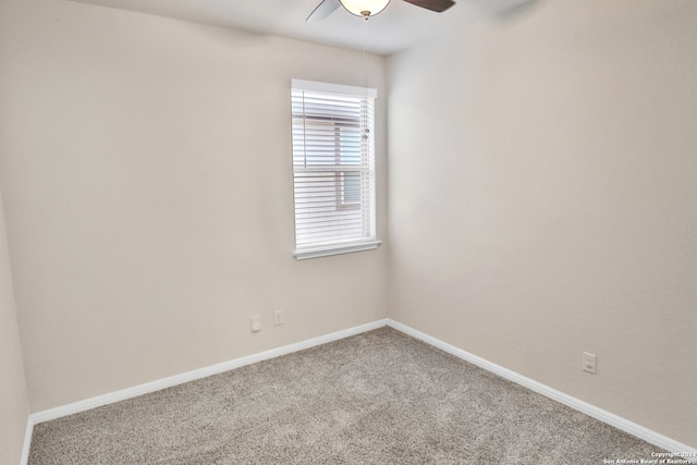 empty room with ceiling fan and carpet flooring