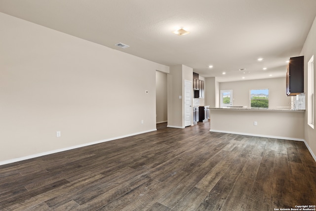 unfurnished living room featuring hardwood / wood-style floors