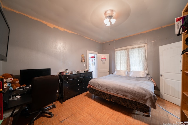 bedroom featuring light parquet floors and ceiling fan