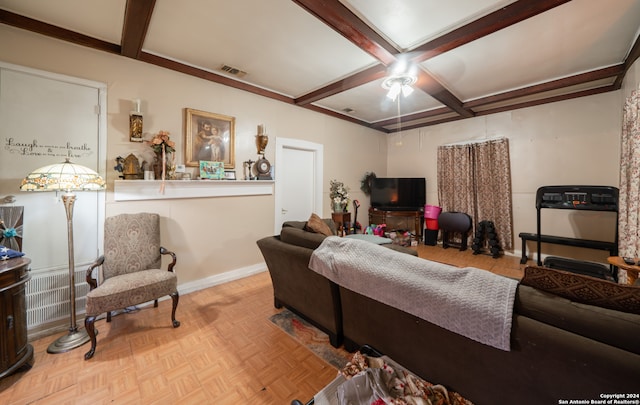 living room with beamed ceiling, light parquet flooring, and ceiling fan