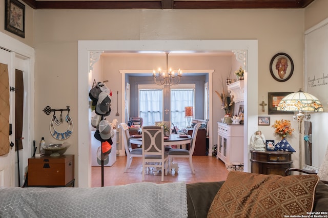 dining room featuring wood-type flooring, french doors, and a chandelier