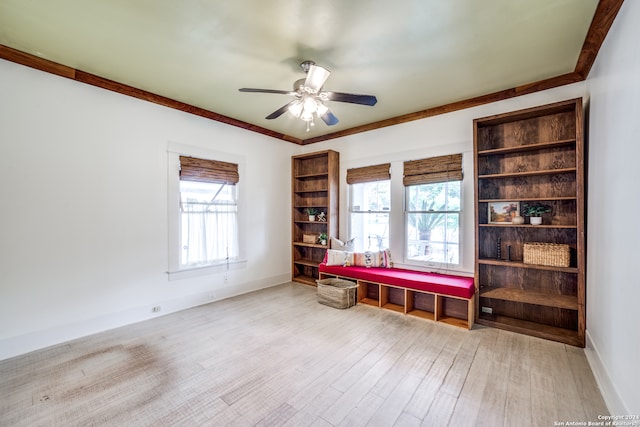 interior space featuring light hardwood / wood-style flooring, a wealth of natural light, ceiling fan, and crown molding