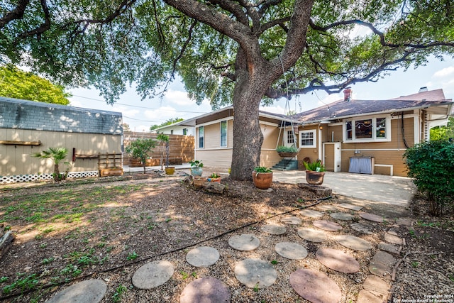 back of house featuring a patio area