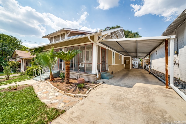 view of front of home with a carport