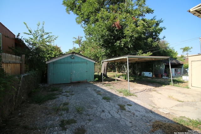 garage featuring a carport