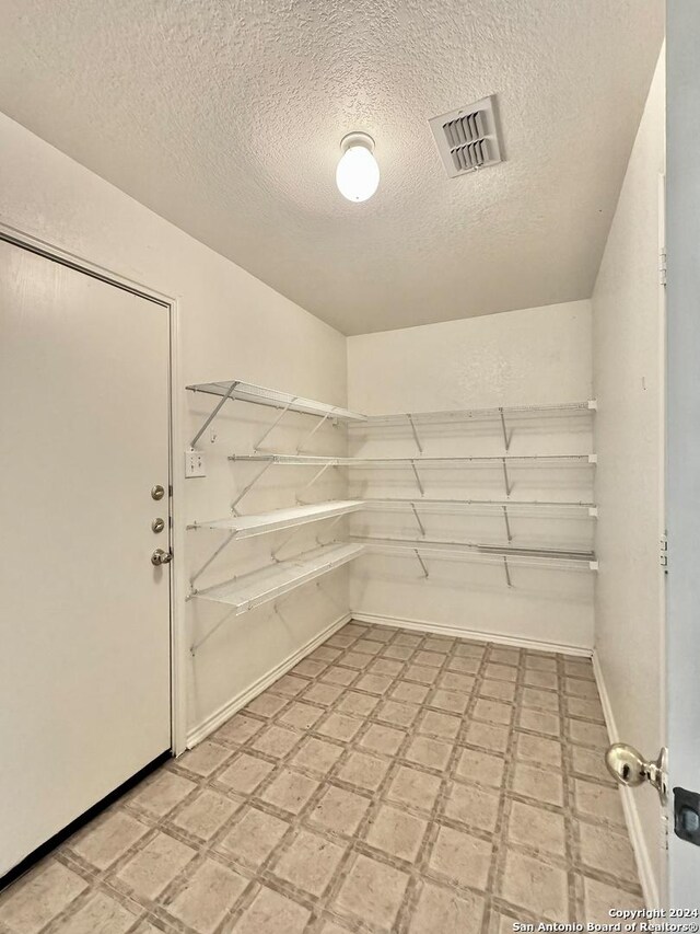 interior space featuring a textured ceiling