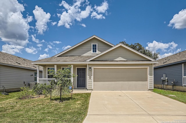 view of front facade with a garage, central AC, a front lawn, and a porch